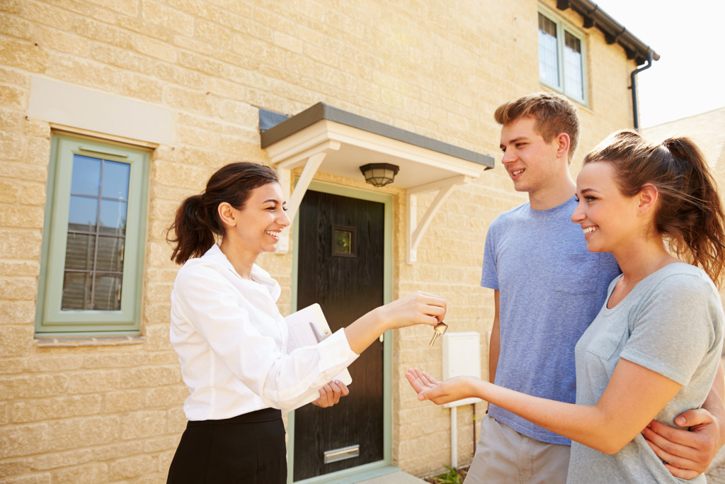 real estate agent with her clients